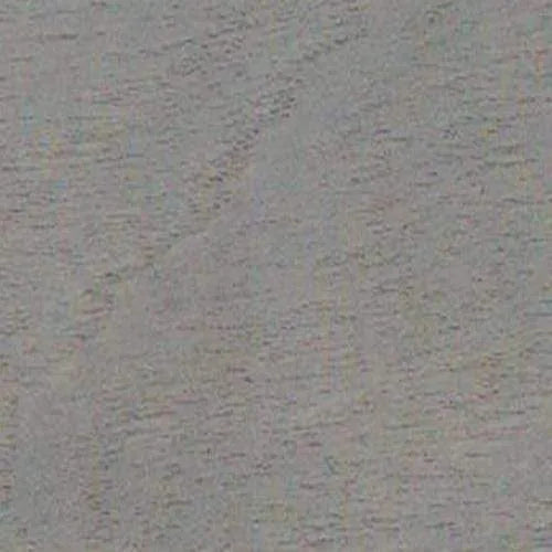 Texture grise de surface, aspect rugueux ou fibreux, avec de légères variations de teinte.